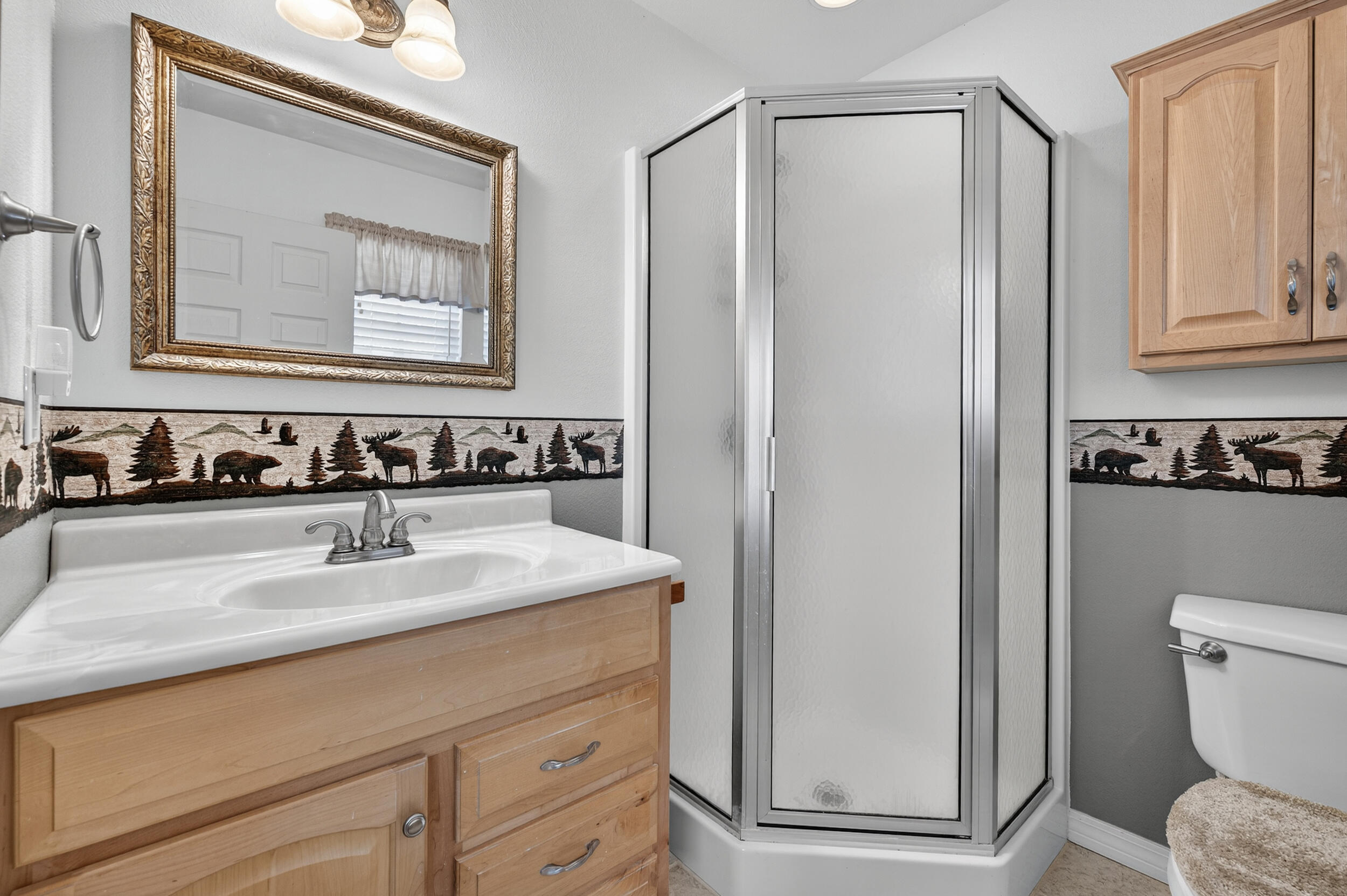 5378 Staghorn Road Crestview, FL 32539 - Photo 29 of 130 a bathroom with a sink a toilet and a mirror
