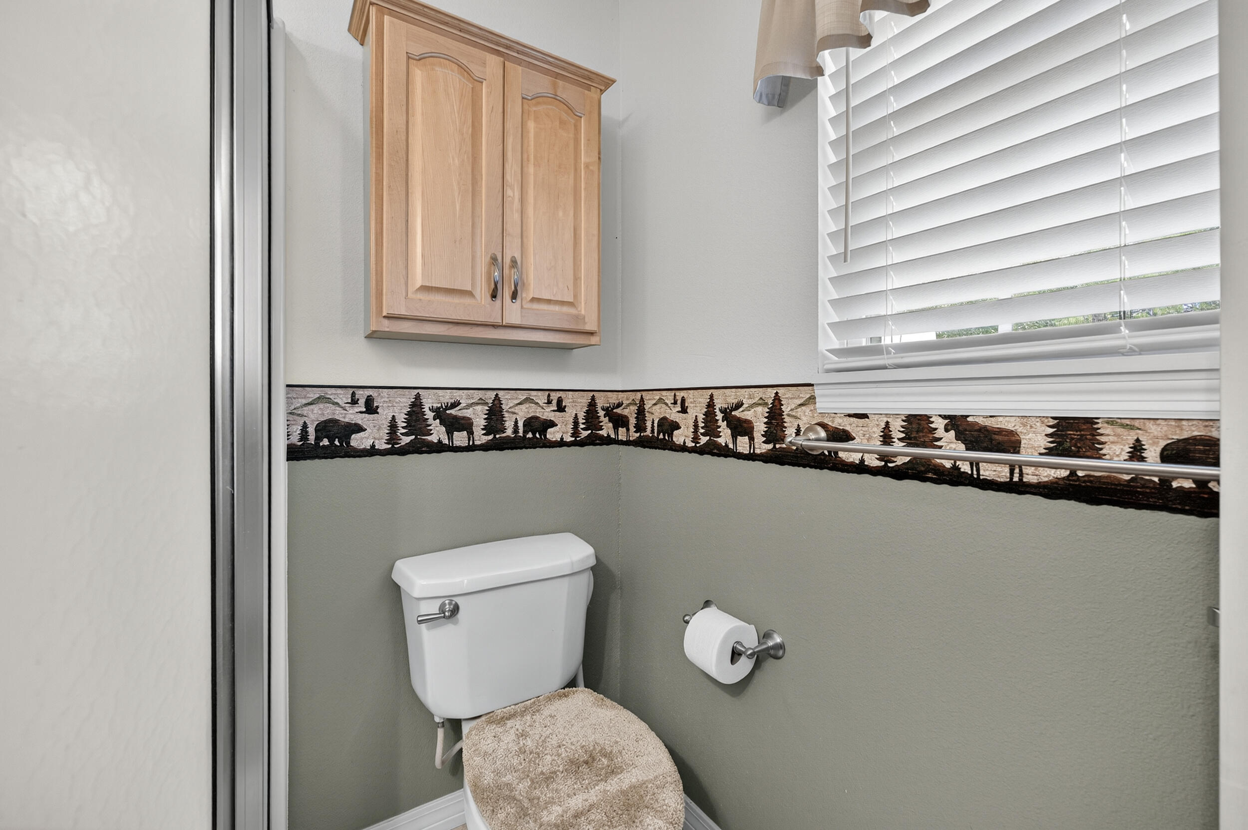 5378 Staghorn Road Crestview, FL 32539 - Photo 30 of 130 a bathroom with a toilet a sink and a window