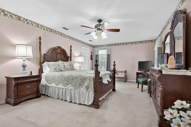 a kitchen with white cabinets sink and appliances