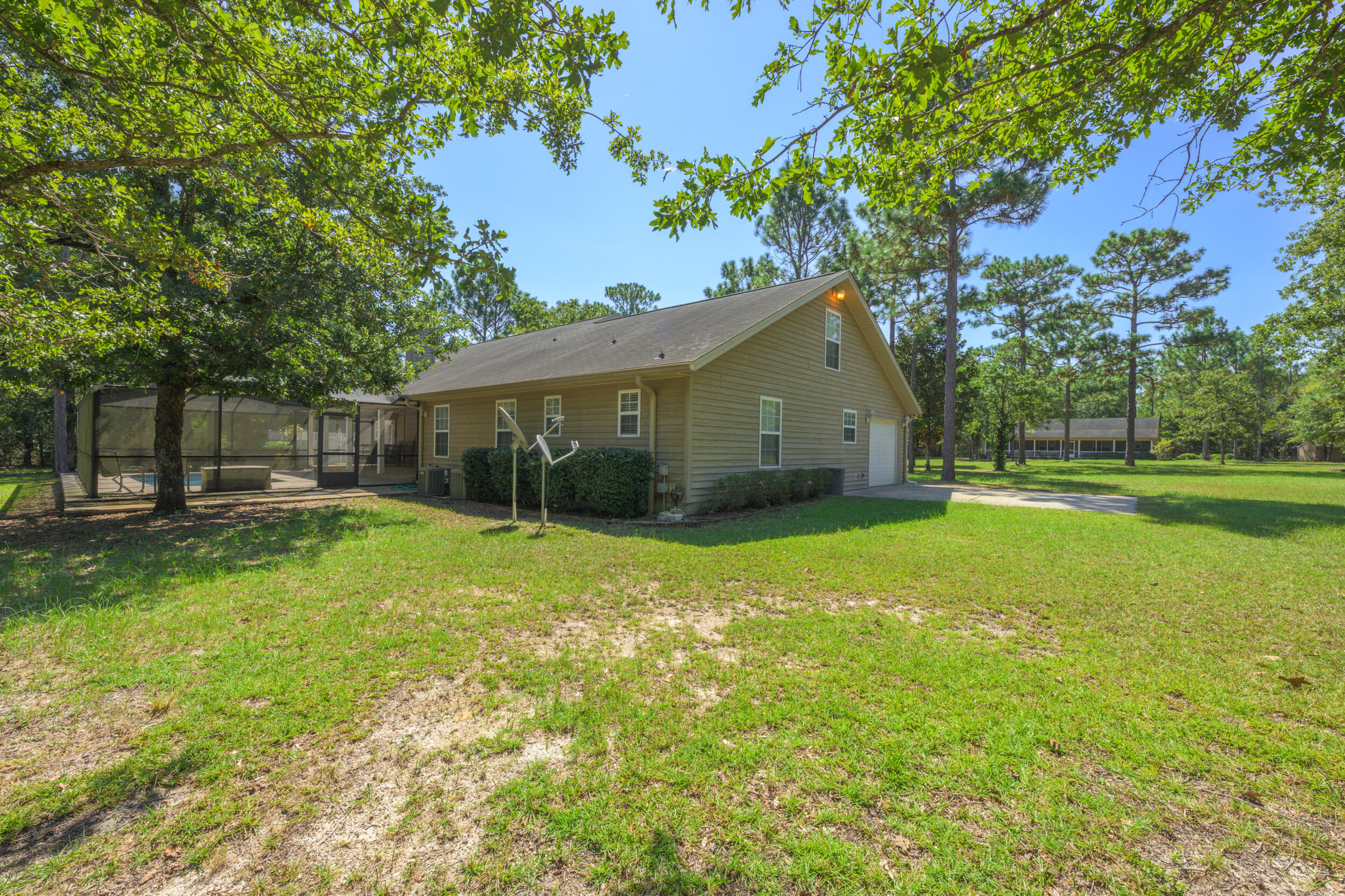 5378 Staghorn Road Crestview, FL 32539 - Photo 49 of 130 a view of a house with backyard and sitting area