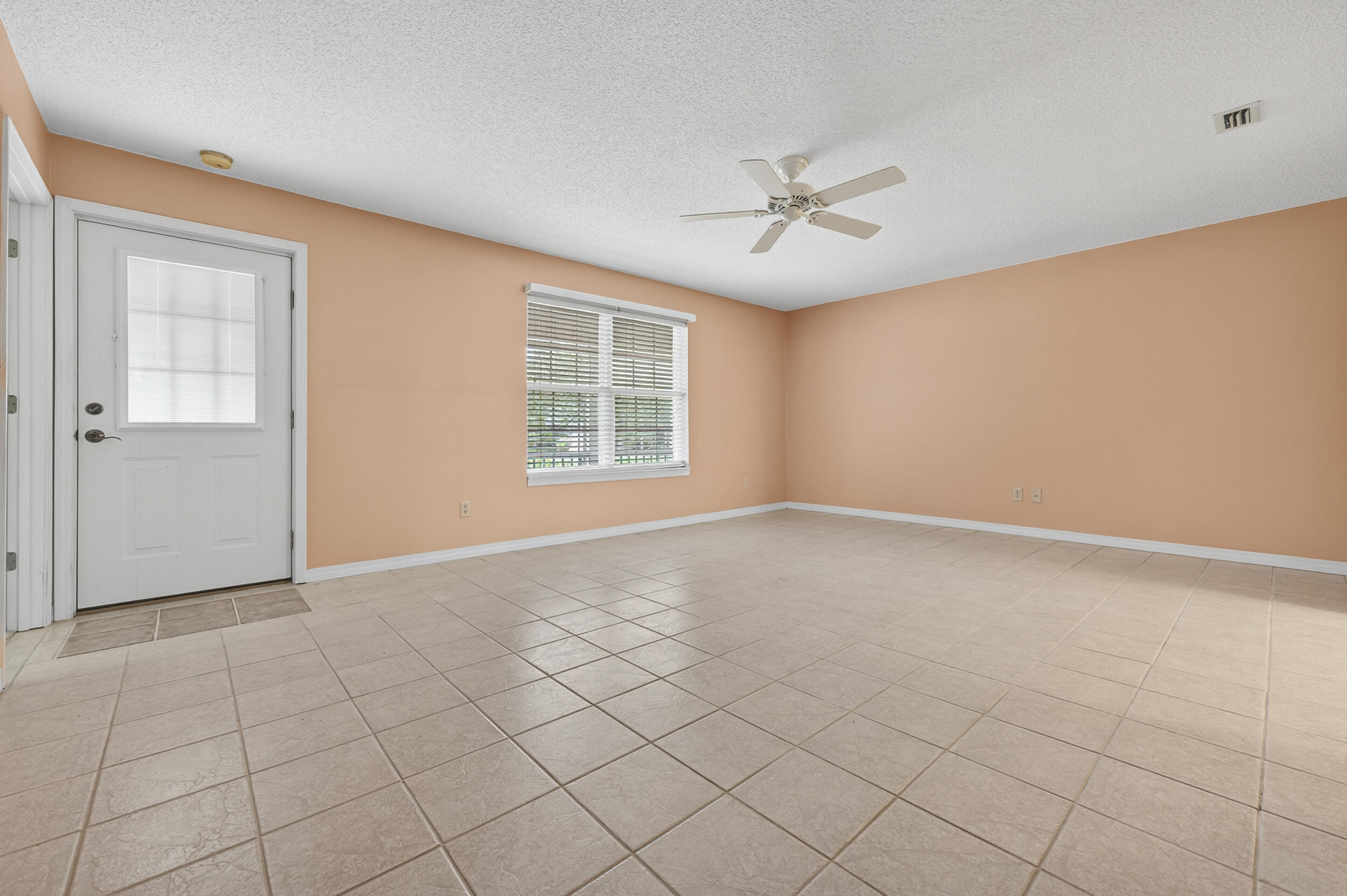 5378 Staghorn Road Crestview, FL 32539 - Photo 72 of 130 an empty room with windows and fan