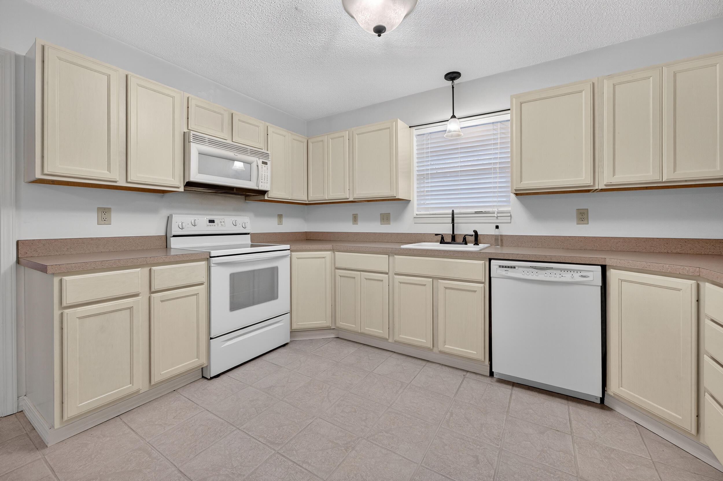 5378 Staghorn Road Crestview, FL 32539 - Photo 77 of 130 a kitchen with white cabinets sink and appliances