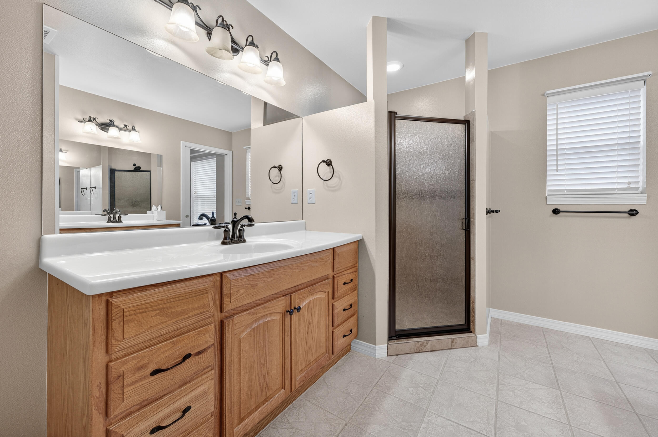5378 Staghorn Road Crestview, FL 32539 - Photo 86 of 130 a bathroom with a double vanity sink and a mirror