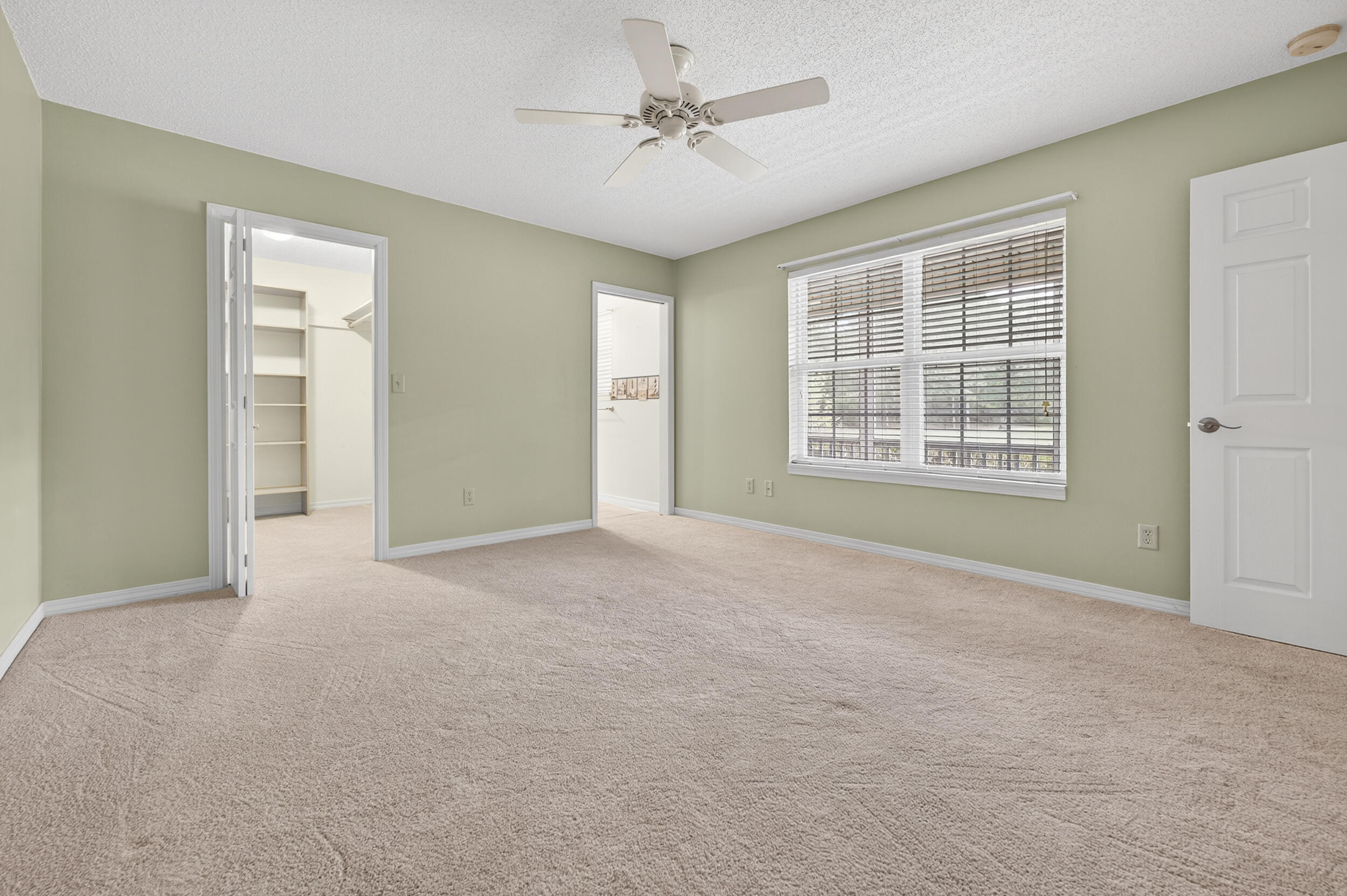 5378 Staghorn Road Crestview, FL 32539 - Photo 97 of 130 an empty room with windows and ceiling fan