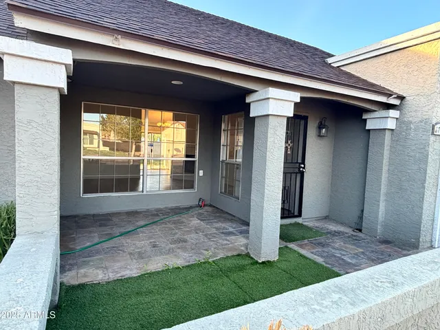 a view of house with backyard porch and entertaining space