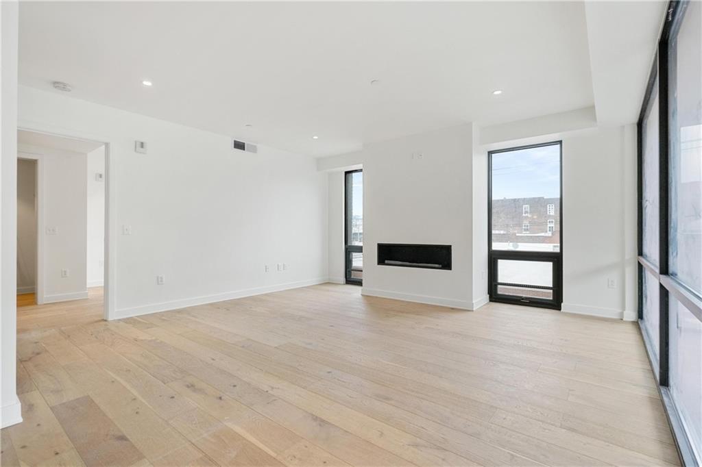 2330 Penn Avenue, Unit 302 Pittsburgh, PA 15222 - Photo 14 of 27 a view of an empty room with a window