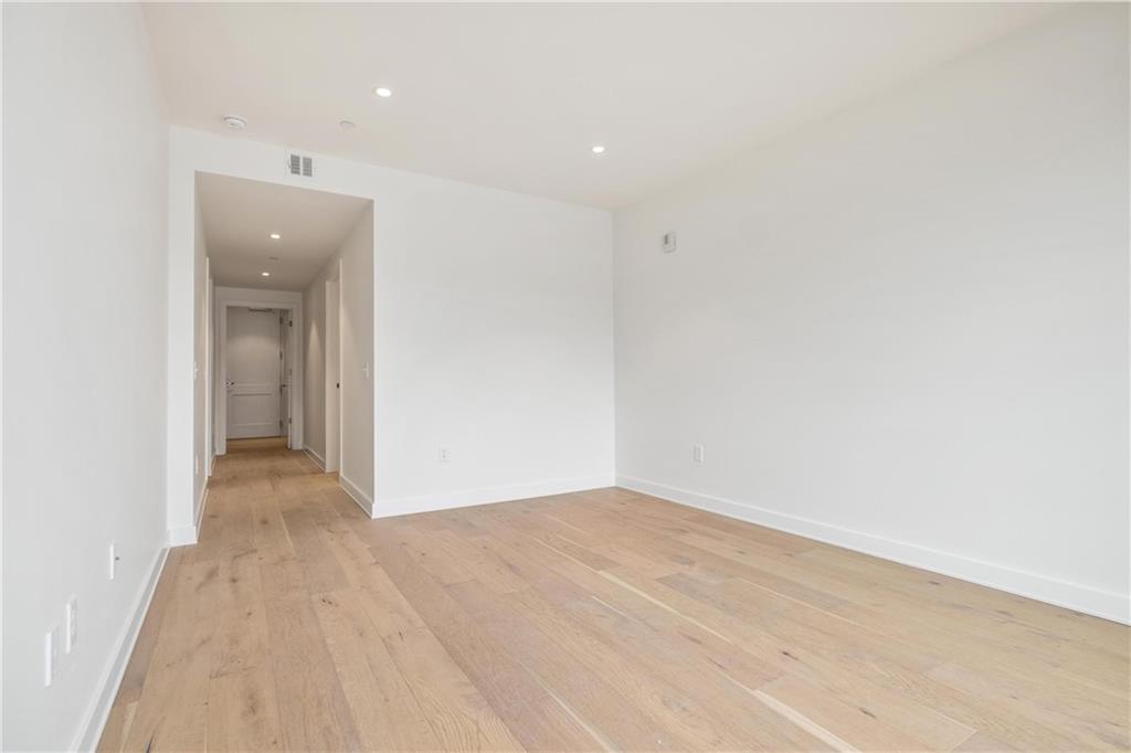 2330 Penn Avenue, Unit 302 Pittsburgh, PA 15222 - Photo 22 of 27 a view of a big room with wooden floor and natural light