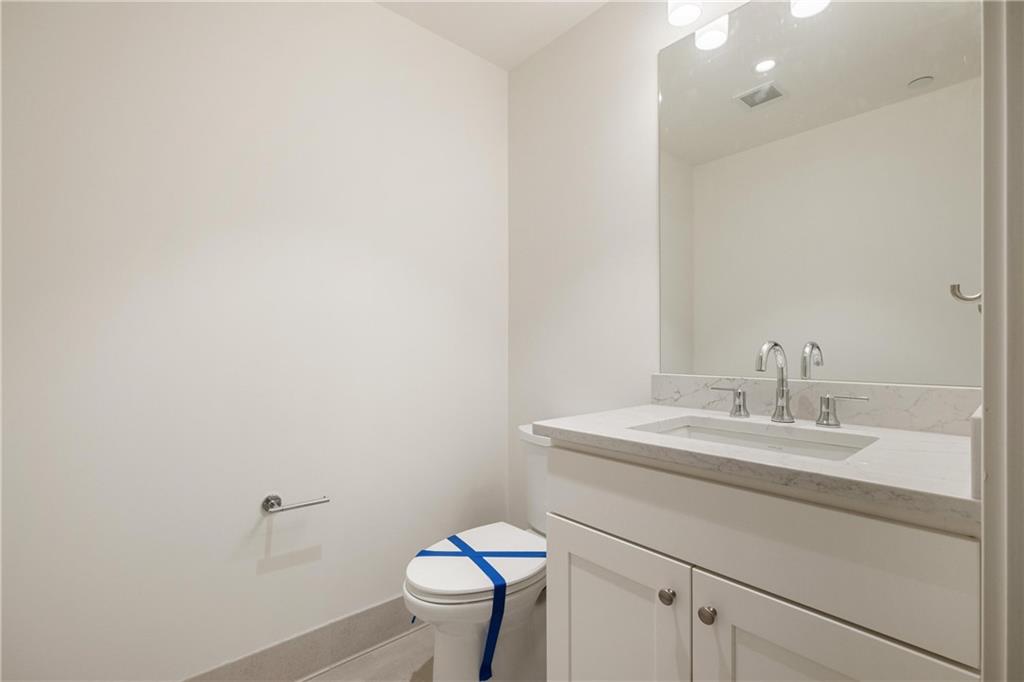 2330 Penn Avenue, Unit 302 Pittsburgh, PA 15222 - Photo 25 of 27 a bathroom with a sink toilet and a mirror