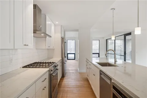 a kitchen with counter top space and appliances