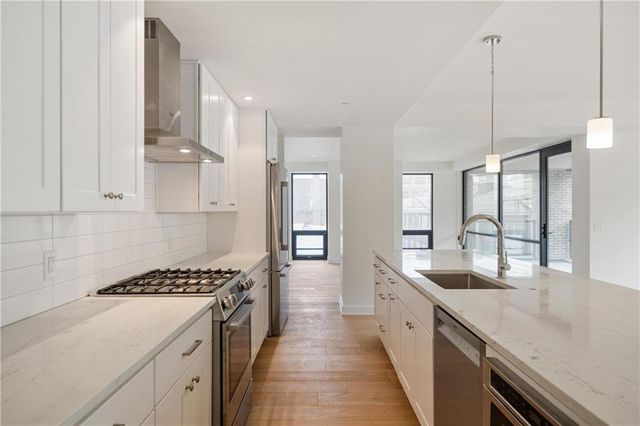 a kitchen with counter top space and appliances