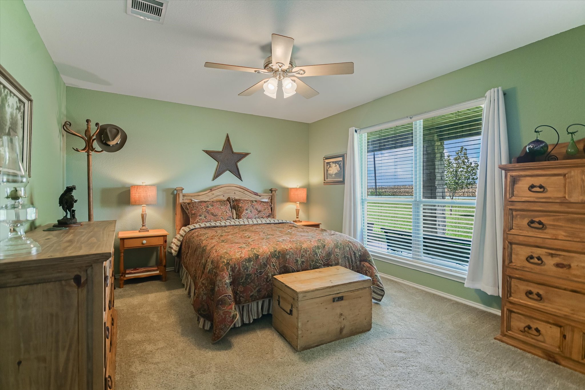 1465 County Road 436 Thrall, TX 76578 - Photo 13 of 27 The roomy secondary bedroom overlooks the home's lovely front yard.