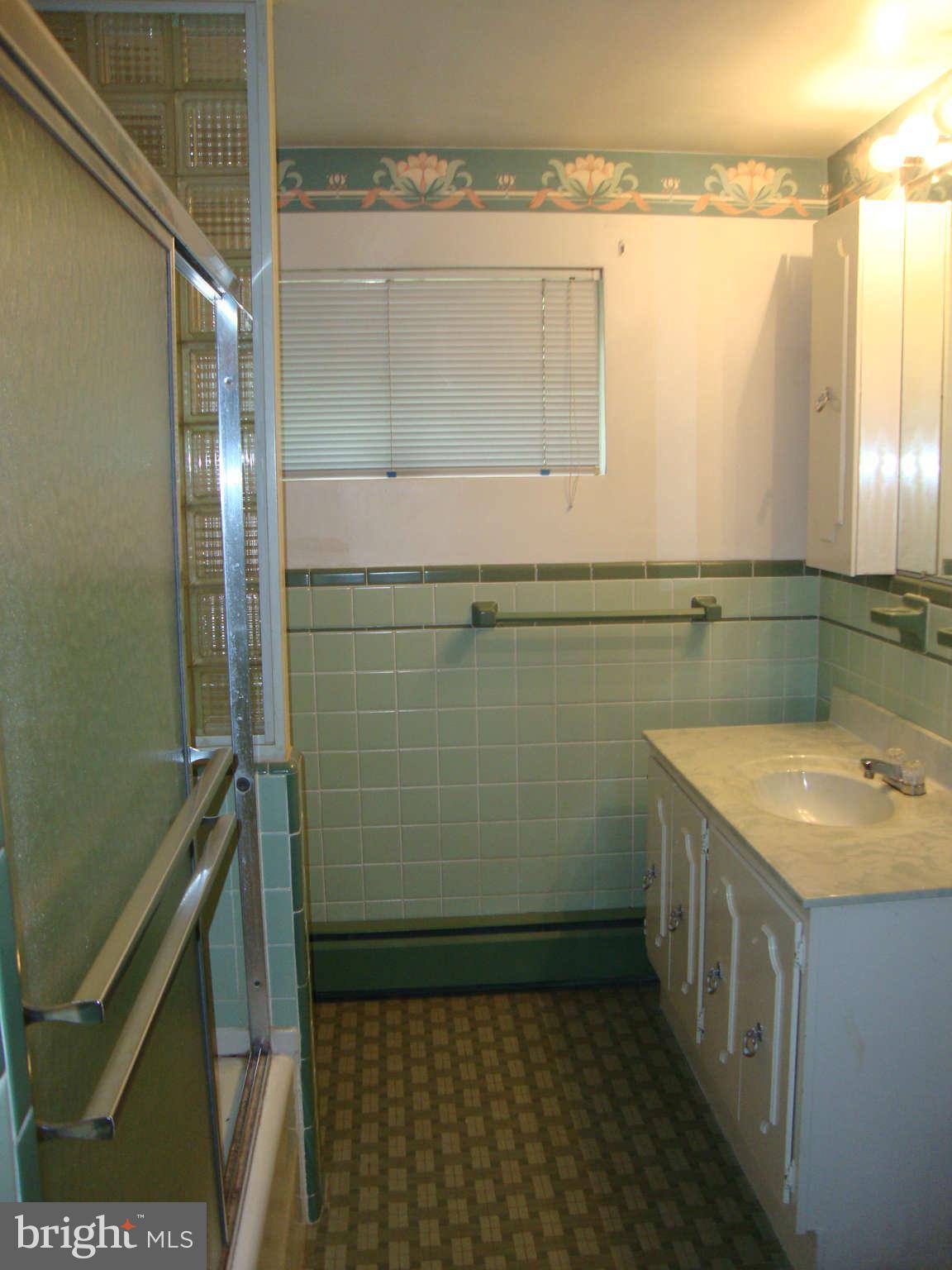 1422 Providence Road Towson, MD 21286 - Photo 14 of 29 a bathroom with a sink a toilet and a shower