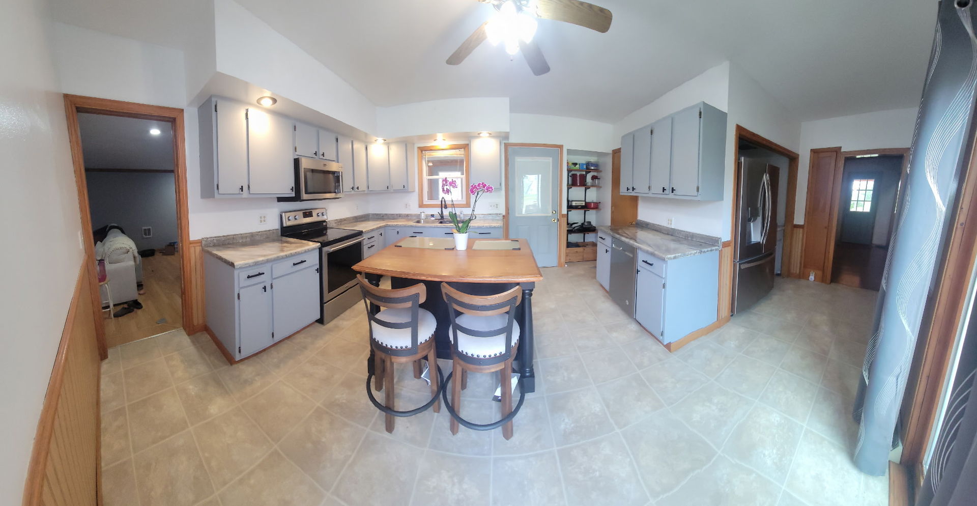 382 Keigwin Road Walnut, IL 61376 - Photo 20 of 49 a large kitchen with a table and chairs