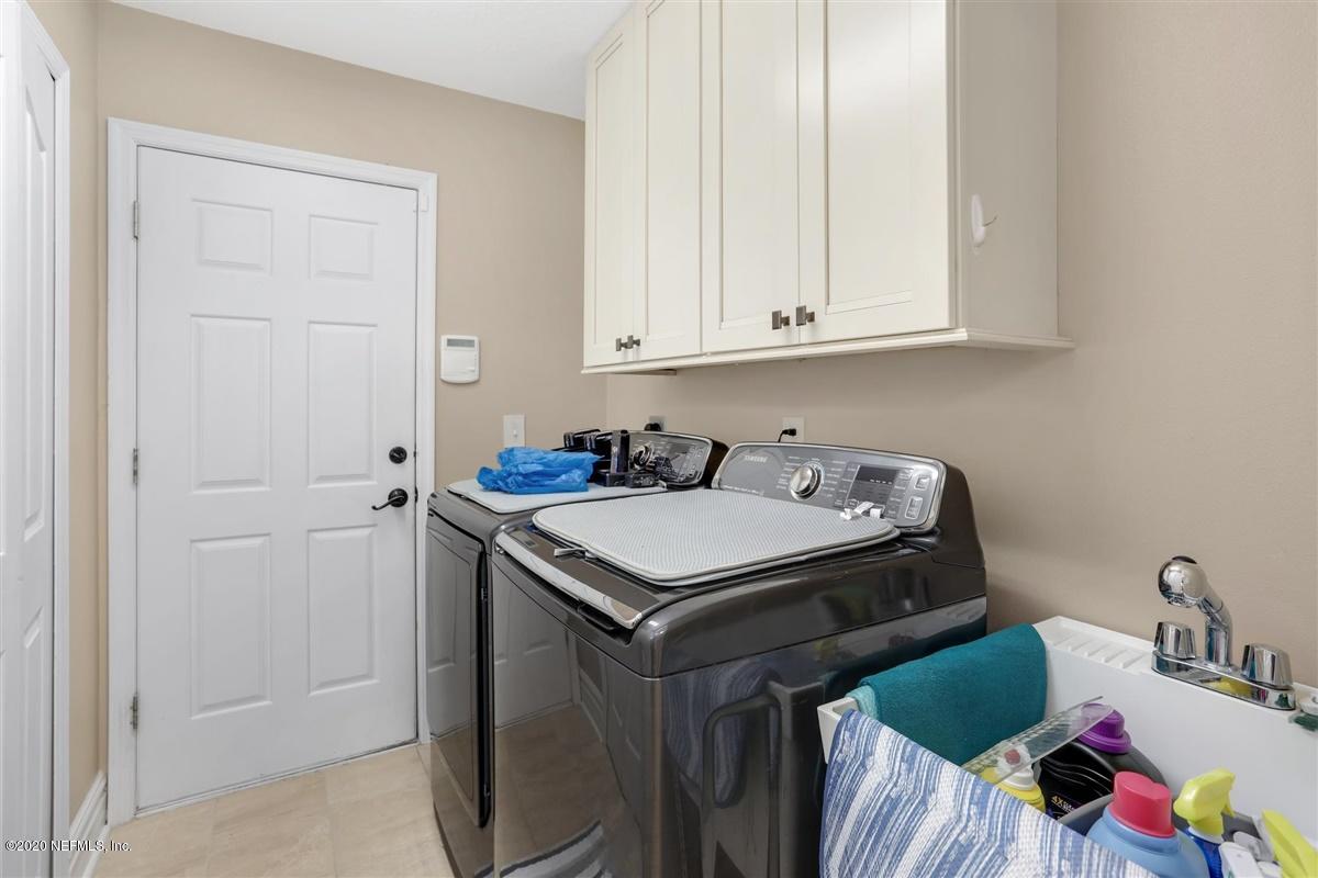 3317 Kings Road South St. Augustine, FL 32086 - Photo 24 of 32 a utility room with a sink dryer and washer