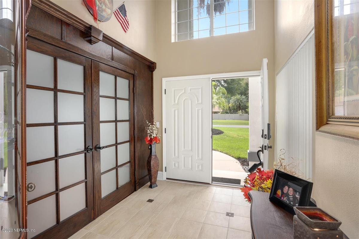 3317 Kings Road South St. Augustine, FL 32086 - Photo 4 of 32 a view of an entryway with wooden floor and door