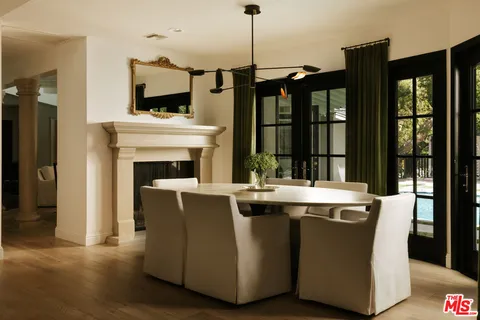 a view of kitchen with sink and refrigerator