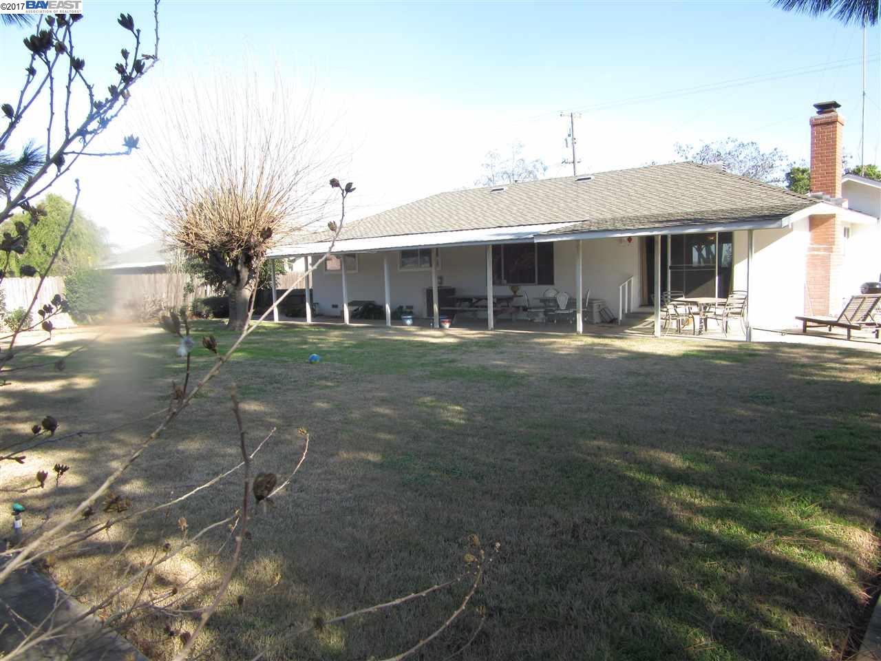 16373 Austin Road Manteca, CA 95336 - Photo 15 of 16 a front view of a house with a yard