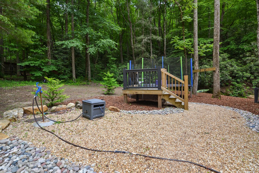 17 Emmaus Walk Blue Ridge, GA 30513 - Photo 47 of 59 a view of a chair and tables back yard of the house