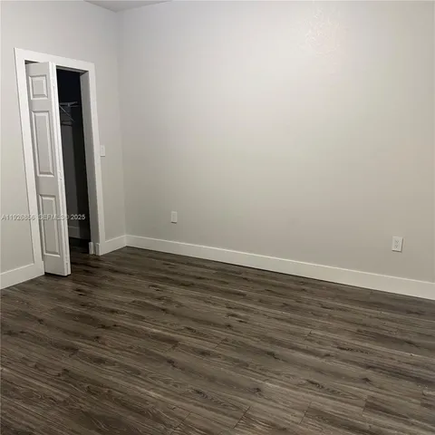 a view of outdoor space and wooden floor