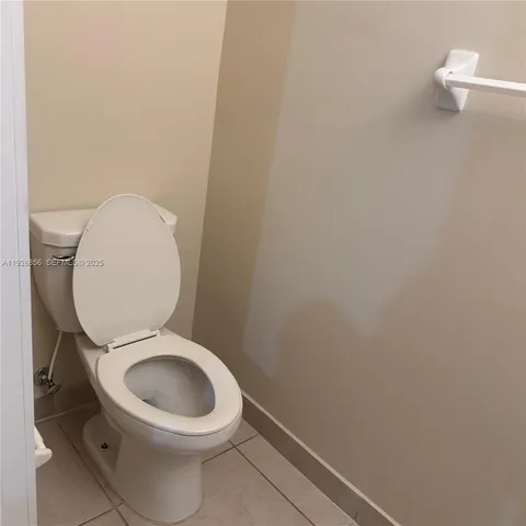 a bathroom with a sink a mirror and a window