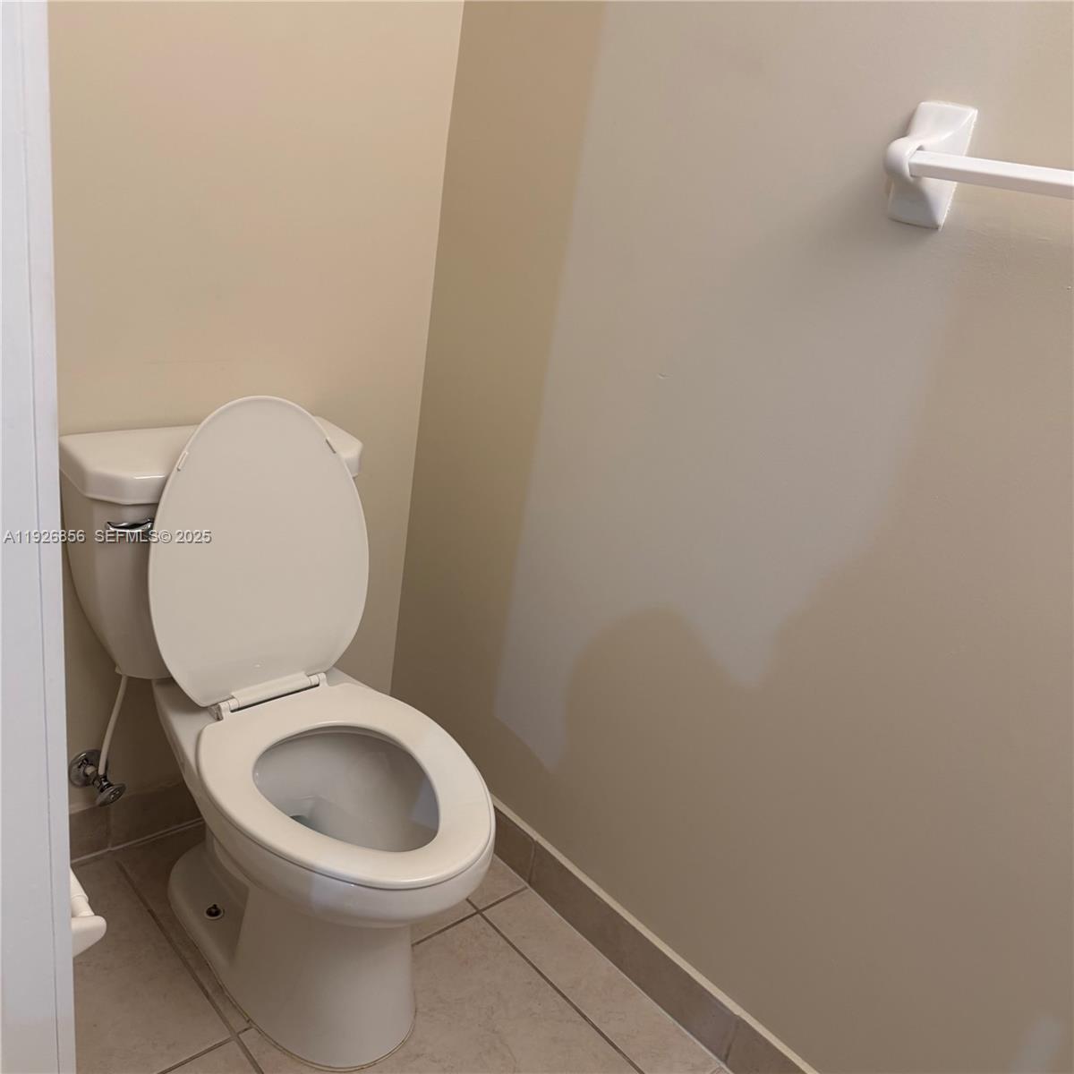 10320 West 33rd Lane Hialeah, FL 33018 - Photo 21 of 29 a close view of a toilet in a bathroom