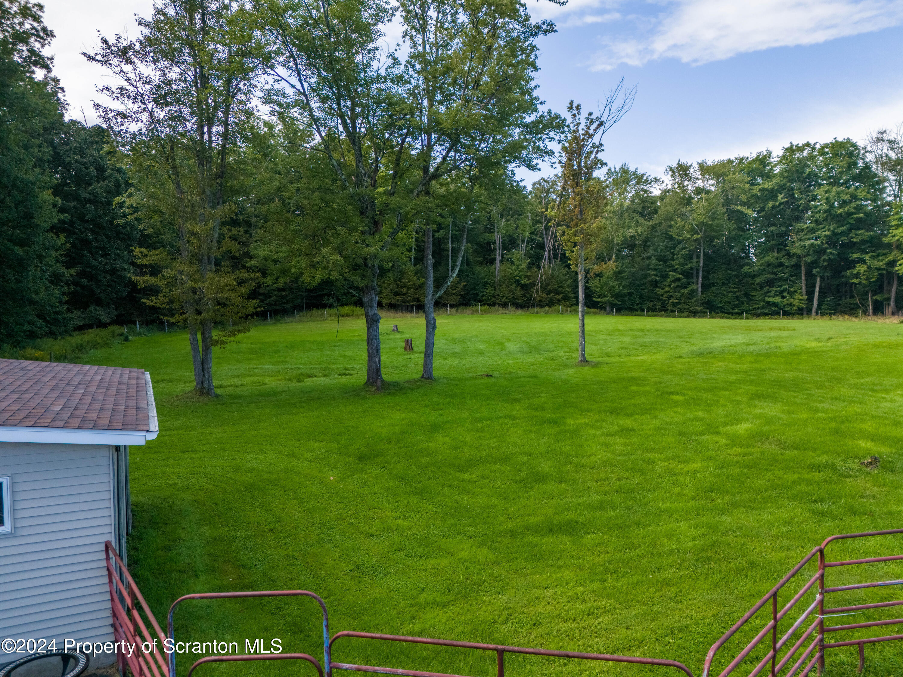 6509 State Rte 2012 Union Dale, PA 18470 - Photo 15 of 91 a view of a wooden deck and a backyard