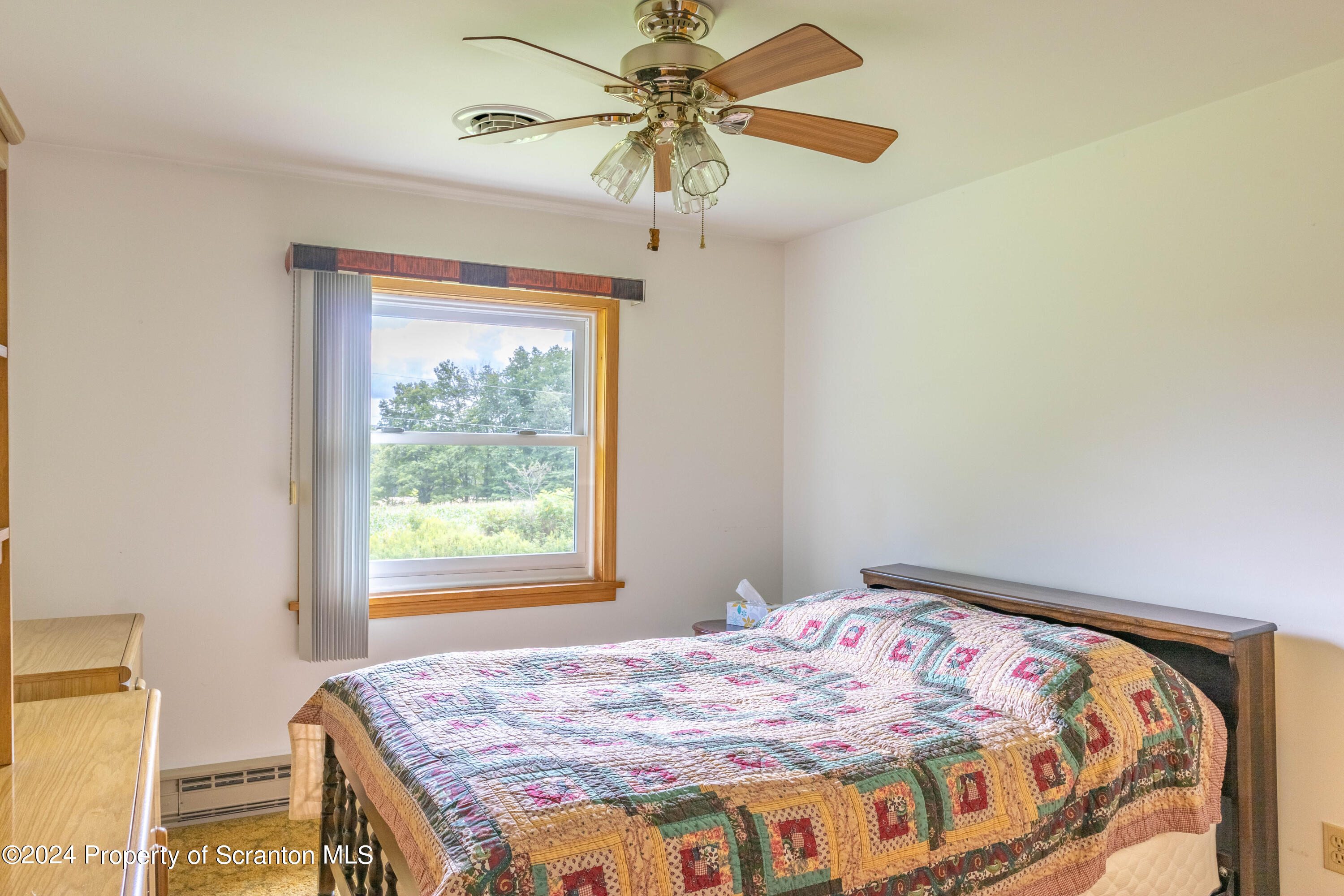 6509 State Rte 2012 Union Dale, PA 18470 - Photo 24 of 91 a bedroom with a bed and a window