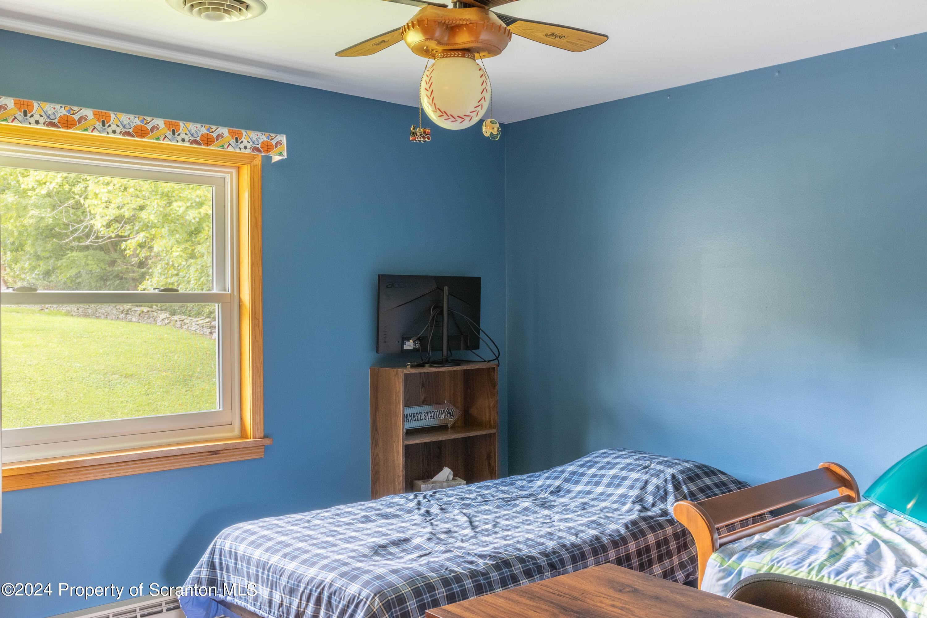 6509 State Rte 2012 Union Dale, PA 18470 - Photo 28 of 91 a bedroom with a bed and a chandelier