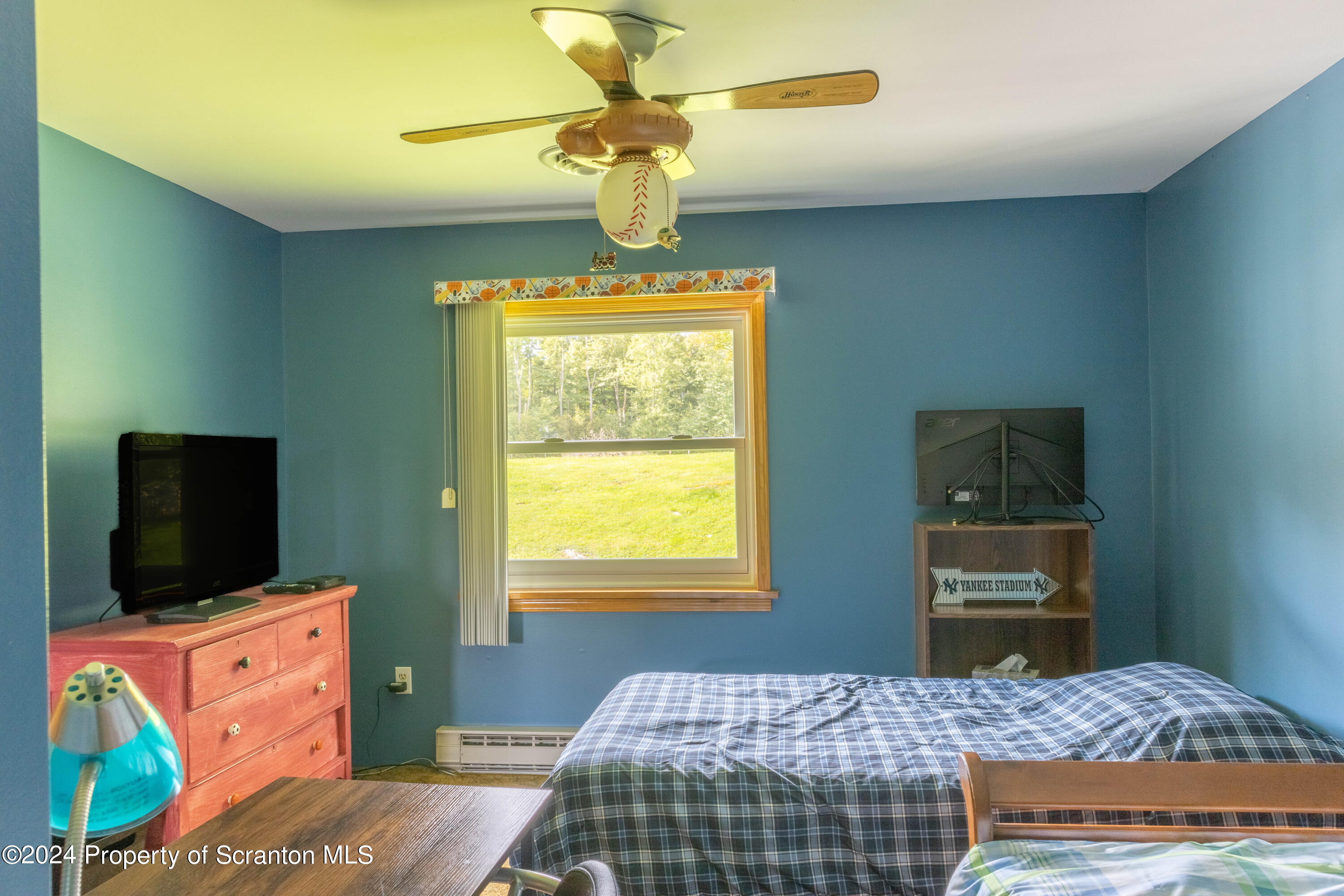 6509 State Rte 2012 Union Dale, PA 18470 - Photo 30 of 91 a bedroom with a bed and flat screen tv