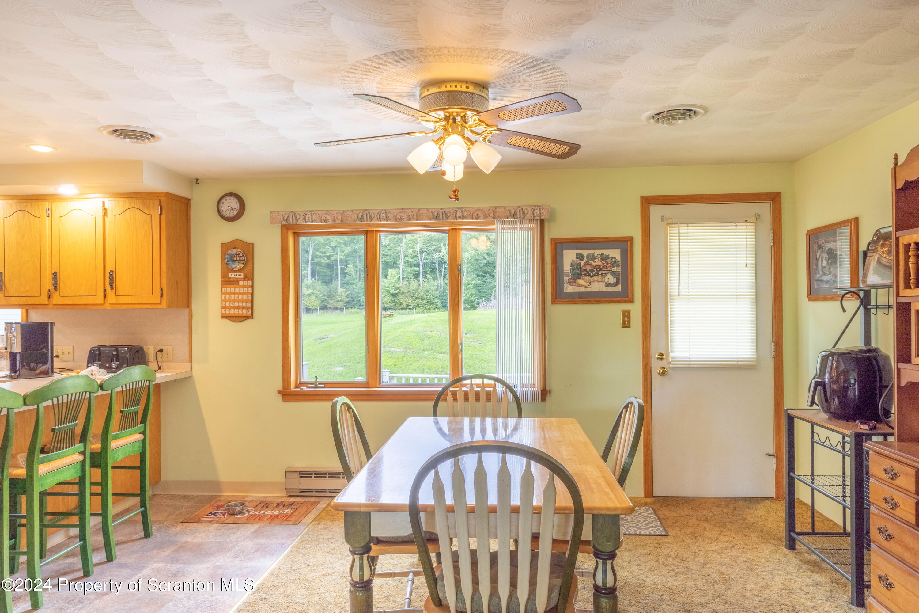 6509 State Rte 2012 Union Dale, PA 18470 - Photo 39 of 91 a view of a dining room with furniture and chandelier