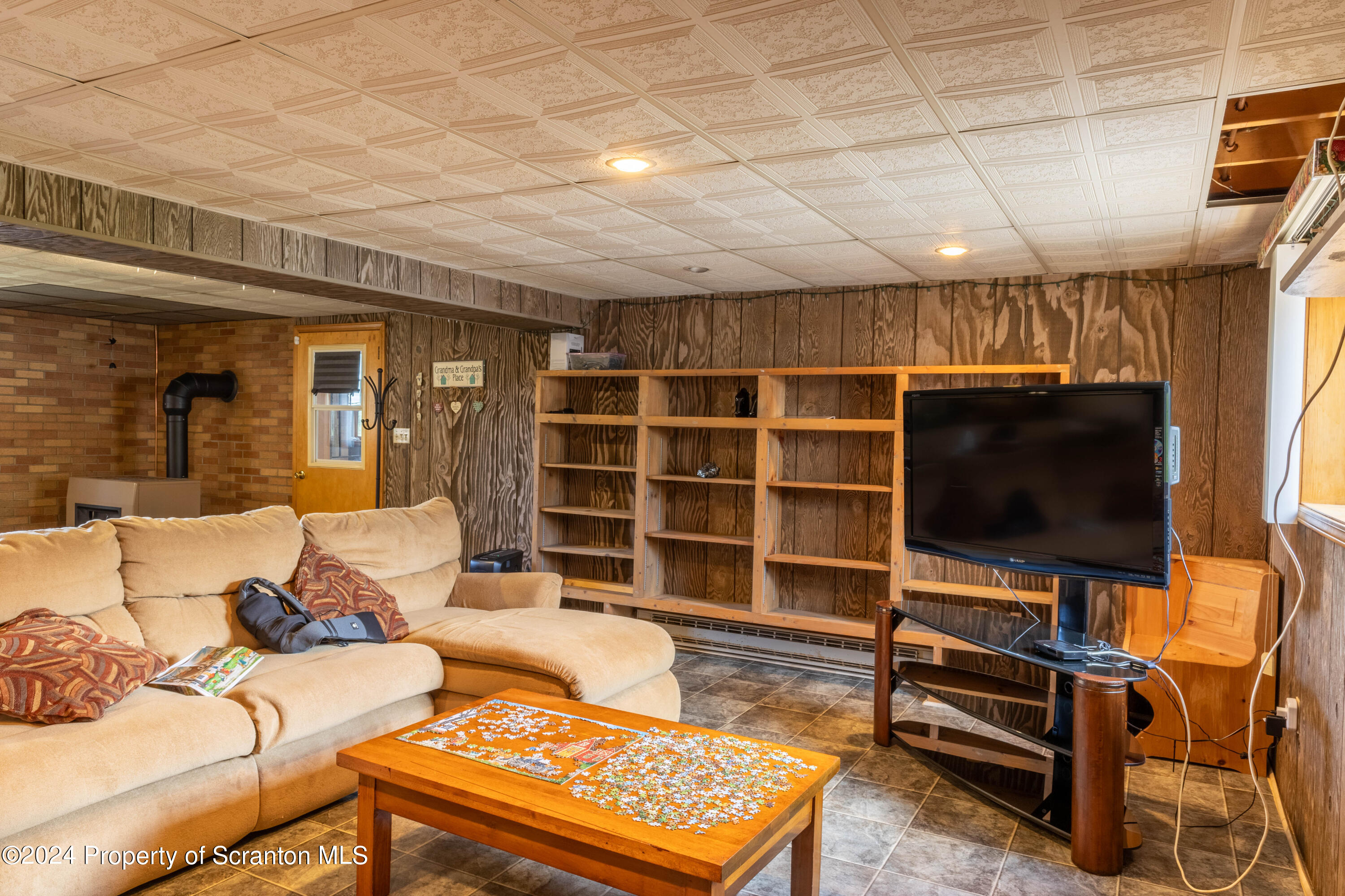 6509 State Rte 2012 Union Dale, PA 18470 - Photo 46 of 91 a living room with furniture and a flat screen tv