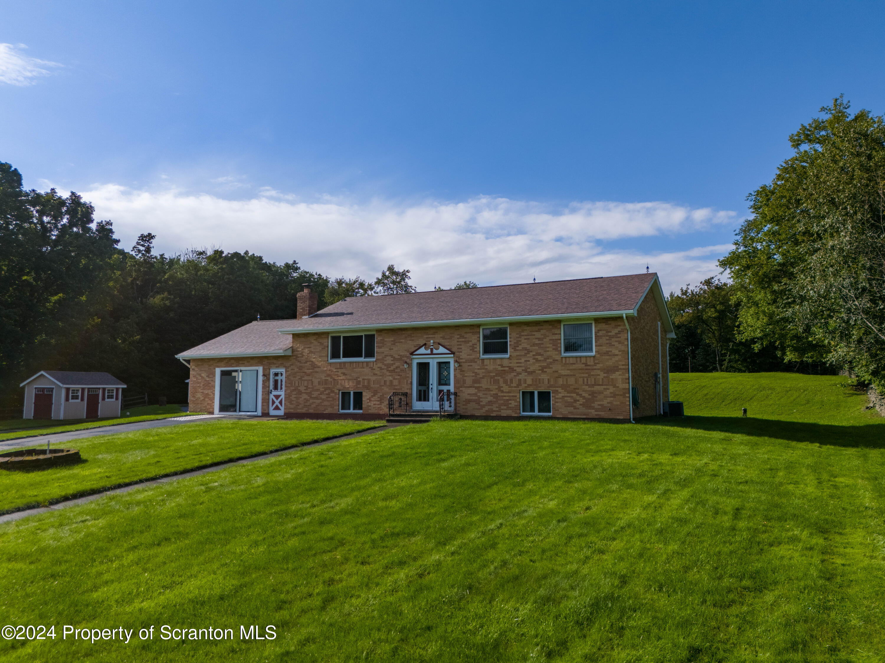 6509 State Rte 2012 Union Dale, PA 18470 - Photo 50 of 91 a view of a house with a big yard and large trees
