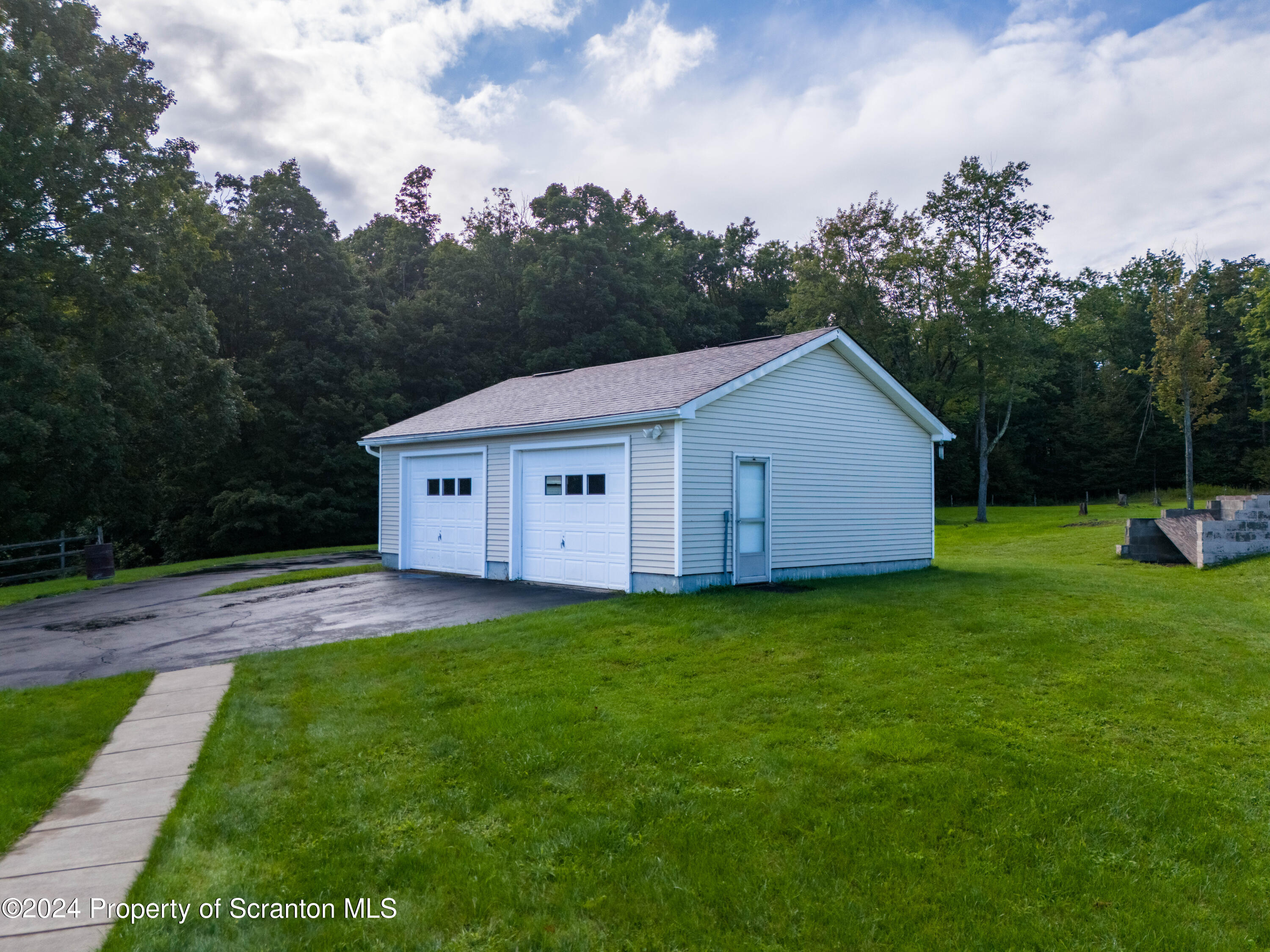 6509 State Rte 2012 Union Dale, PA 18470 - Photo 72 of 91 a backyard of a house with wooden fence and trees