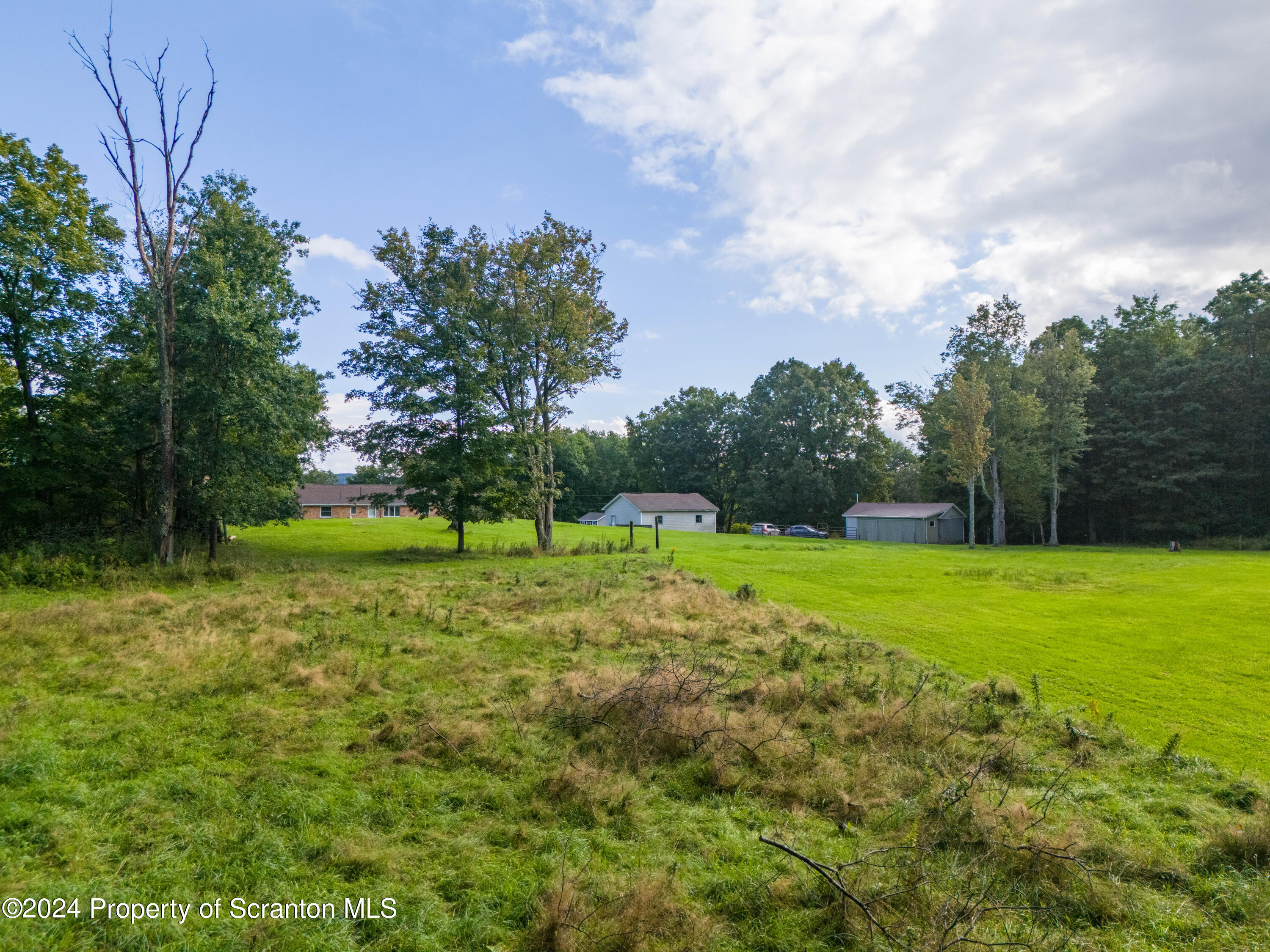 6509 State Rte 2012 Union Dale, PA 18470 - Photo 84 of 91 a view of a golf course with a lake