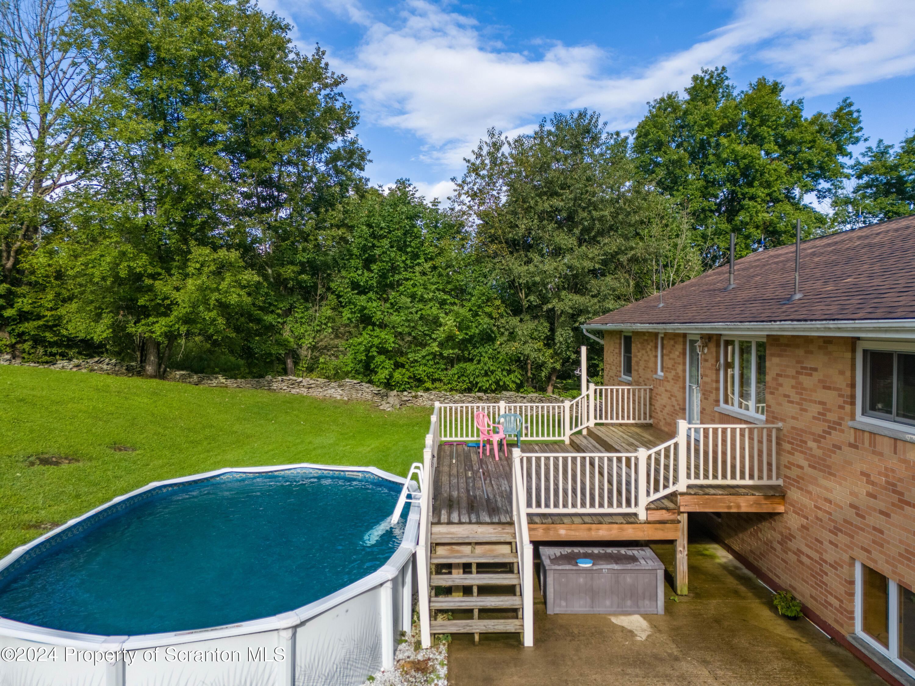 6509 State Rte 2012 Union Dale, PA 18470 - Photo 87 of 91 a view of a house with a deck and a garden