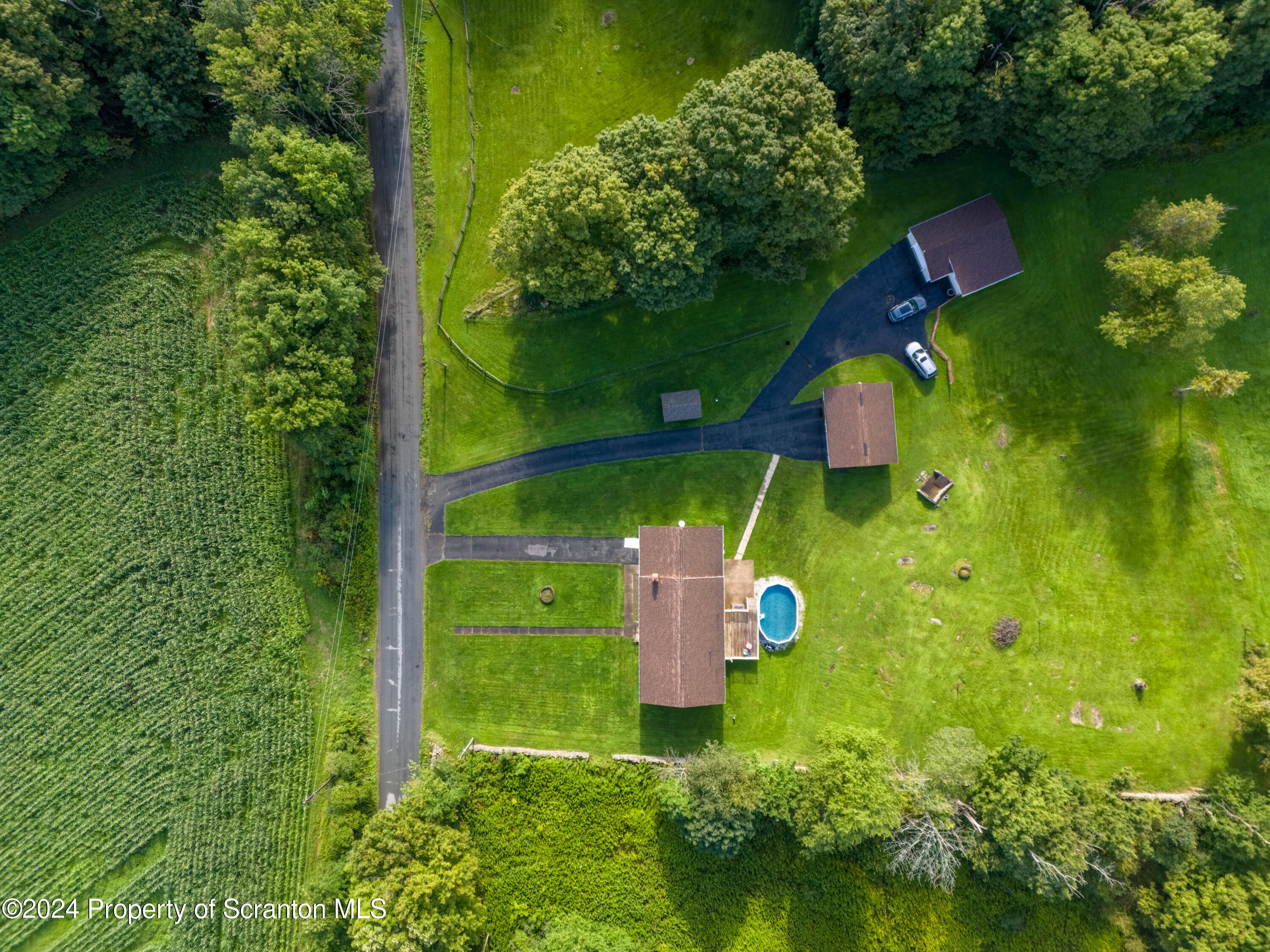 6509 State Rte 2012 Union Dale, PA 18470 - Photo 88 of 91 an aerial view of a golf course with swimming pool