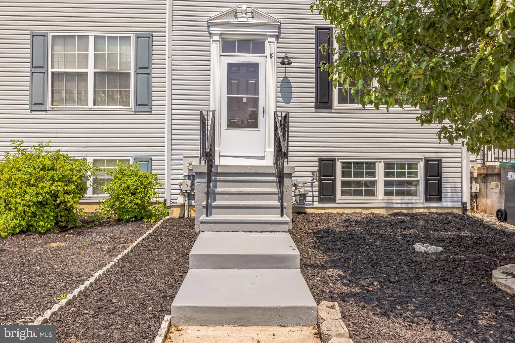 8 Versailles Court Newark, DE 19702 - Photo 2 of 30 a front view of a house with a yard
