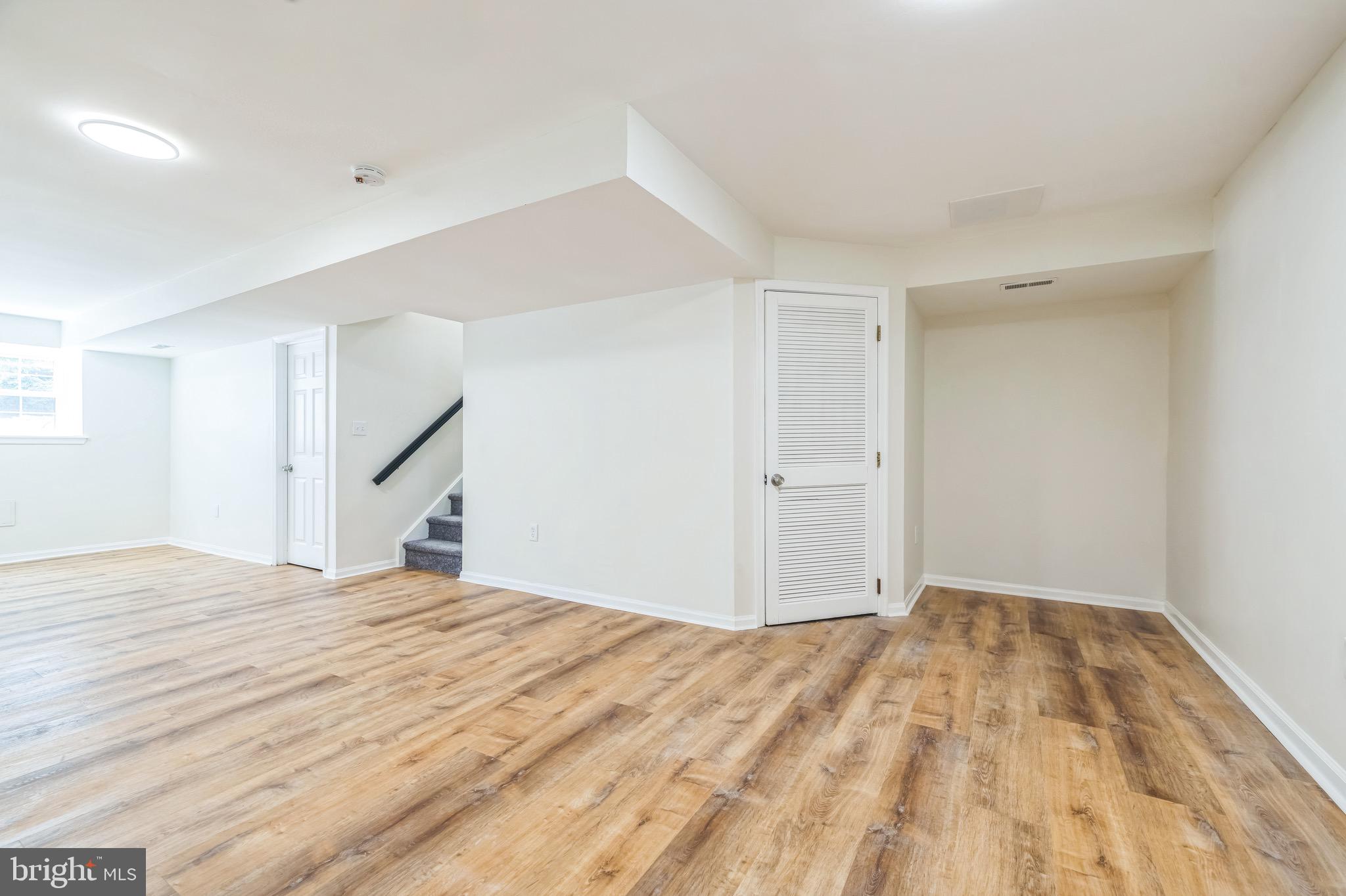 8 Versailles Court Newark, DE 19702 - Photo 22 of 30 a view of empty room with wooden floor
