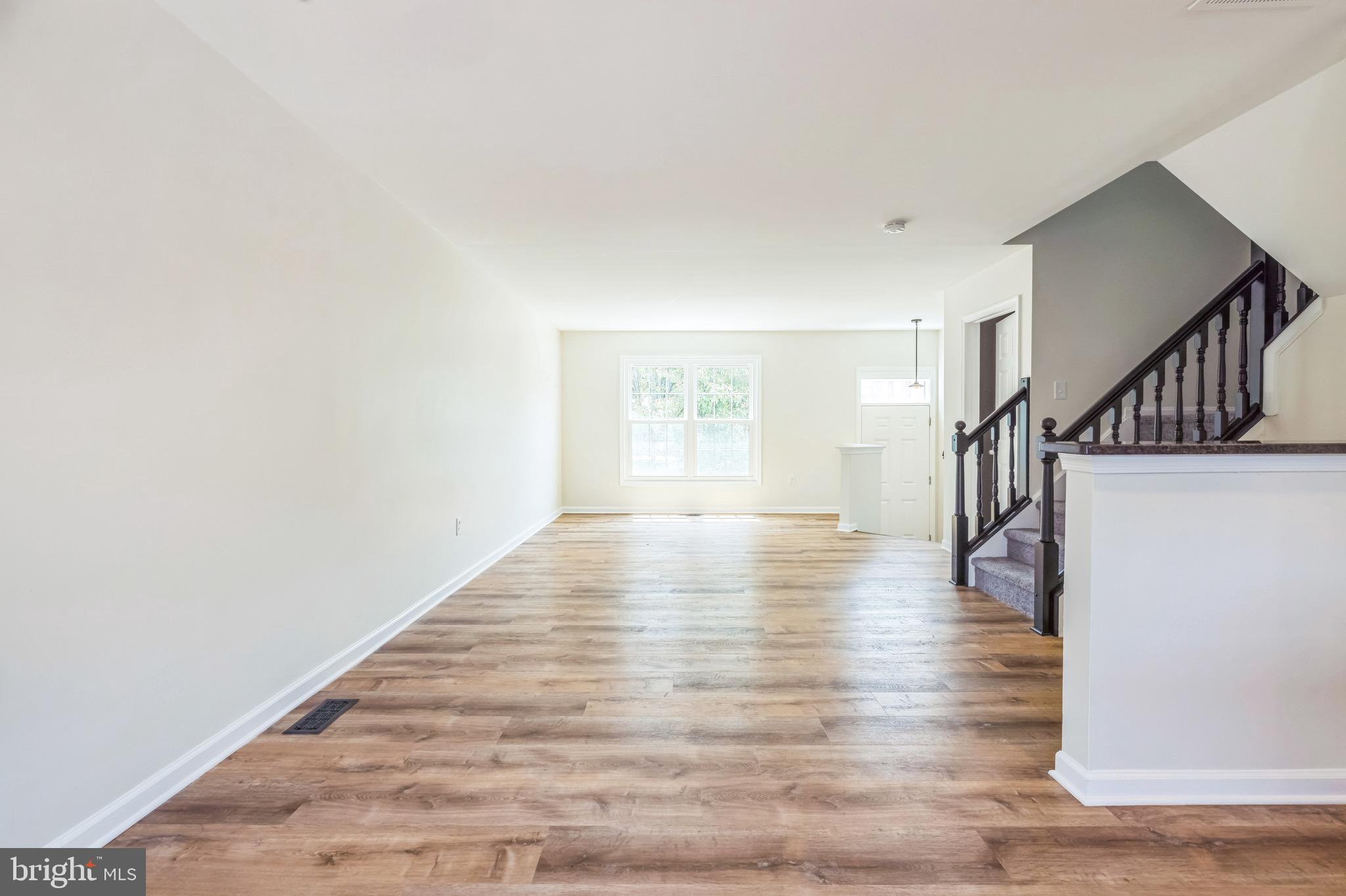 8 Versailles Court Newark, DE 19702 - Photo 4 of 30 a view of an entryway with wooden floor