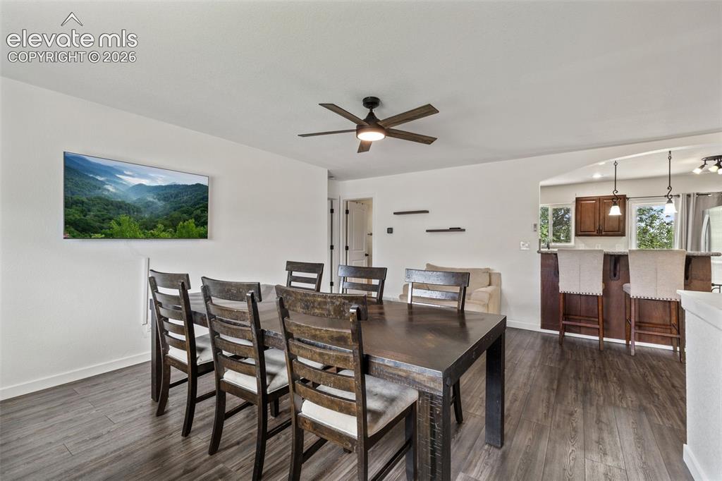 125 Diamond E Road Fountain, CO 80817 - Photo 10 of 43 a view of a dining room with furniture and wooden floor