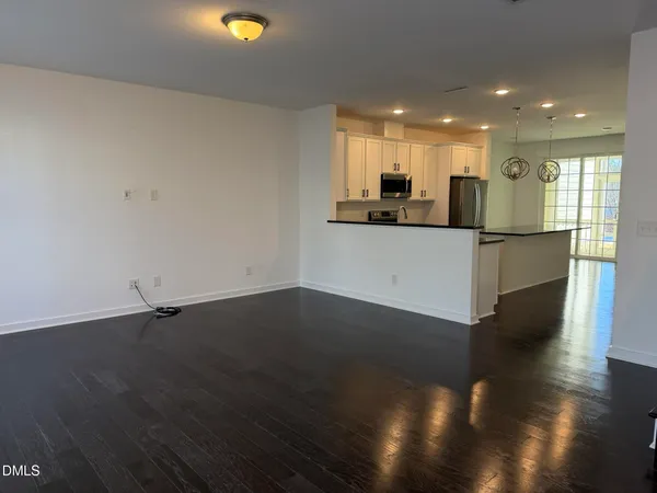 a view of kitchen with wooden floor and window