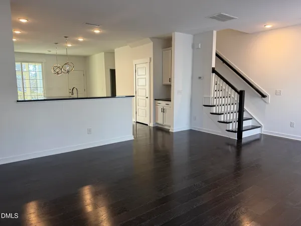 a view of an entryway with wooden floor