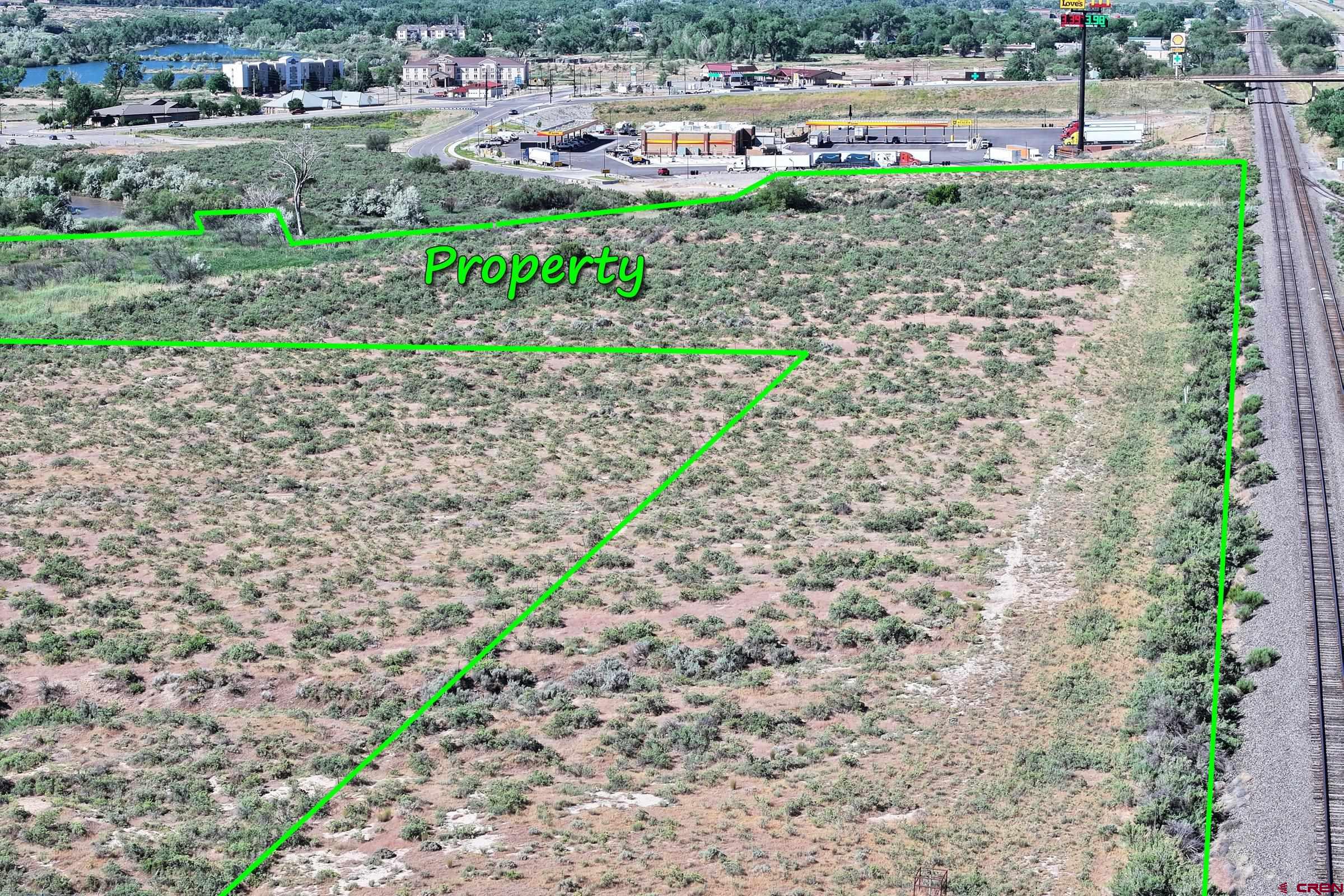 Tbd Tbd Tbd Parachute, CO 81635 - Photo 8 of 11 a view of a street with a yard and trees