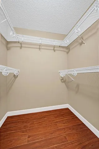 a bathroom with a sink a toilet and a large mirror