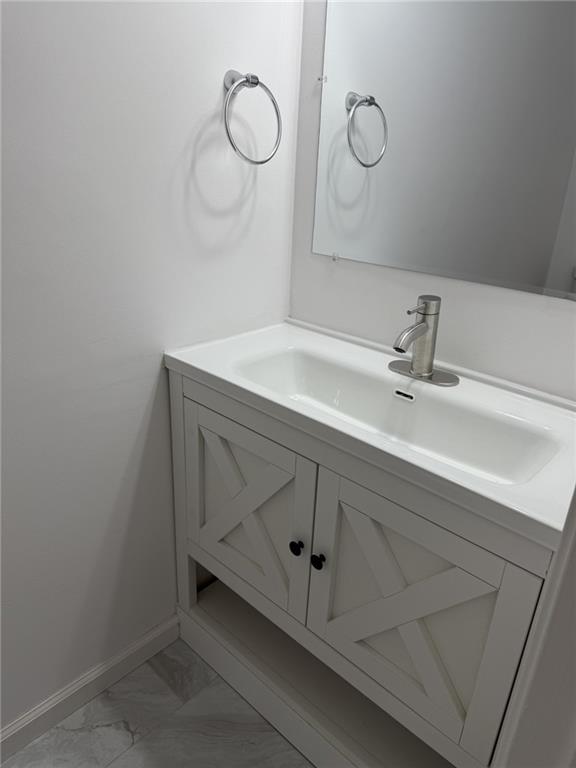 2250 Kings Gate Circle Southwest, Unit B Snellville, GA 30078 - Photo 11 of 31 a bathroom with a sink and vanity