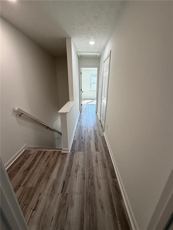 2250 Kings Gate Circle Southwest, Unit B Snellville, GA 30078 - Photo 16 of 31 a view of a hallway with wooden floor and staircase