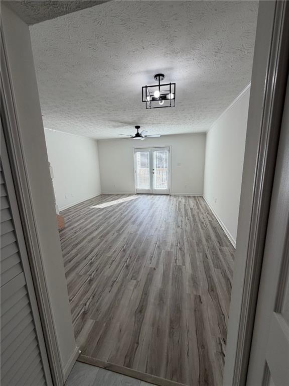 2250 Kings Gate Circle Southwest, Unit B Snellville, GA 30078 - Photo 17 of 31 a view of empty room with wooden floor