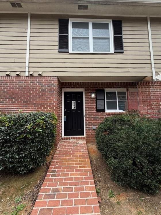 2250 Kings Gate Circle Southwest, Unit B Snellville, GA 30078 - Photo 2 of 31 a front view of a house