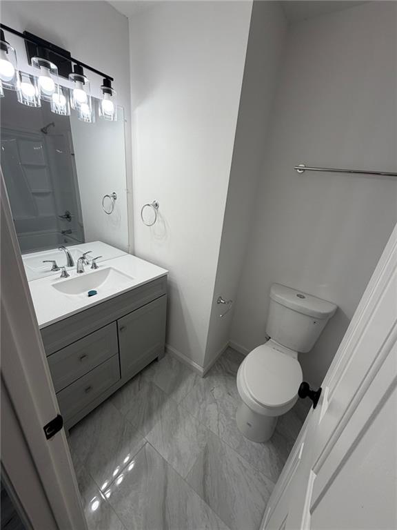 2250 Kings Gate Circle Southwest, Unit B Snellville, GA 30078 - Photo 24 of 31 a bathroom with a sink toilet and shower