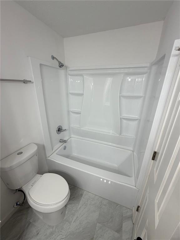 2250 Kings Gate Circle Southwest, Unit B Snellville, GA 30078 - Photo 25 of 31 a bathroom with a toilet and a shower